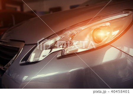 The headlights and the hood of a black sports car 40458401