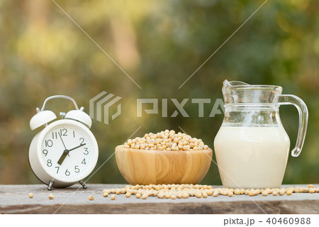 Soy milk and soy beans on wood background. Soy milk and soy beans on wood background. 40460988