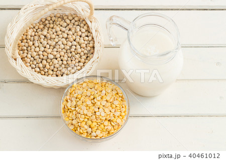Soy milk and soy beans on wood background. 40461012