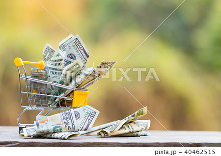 Dollar bill collect on shopping cart. 40462515