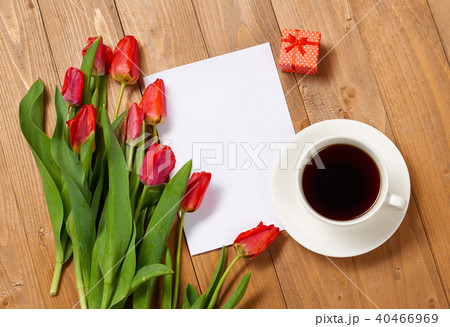 tulips are on wooden boards, cup of coffee tulips are on wooden boards, cup of coffee 40466969
