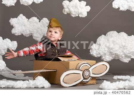boy plays airplane and dreams of becoming a pilot 40470562