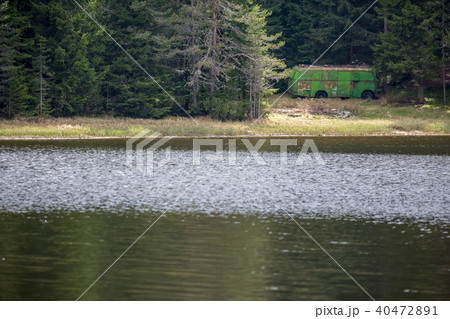 Old rusty bus storage at mountain lake Old rusty bus storage at mountain lake 40472891