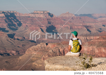 Tourist with backpack at Grand Canyon Tourist with backpack at Grand Canyon 40473568