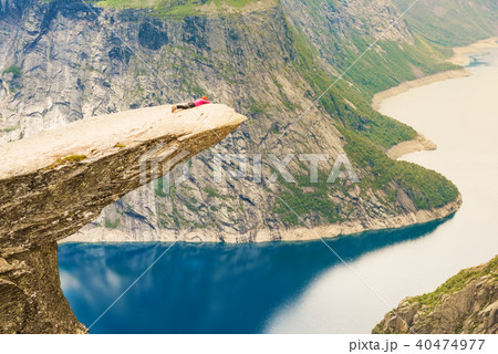 Sporty woman posing on Trolltunga Norway Sporty woman posing on Trolltunga Norway 40474977