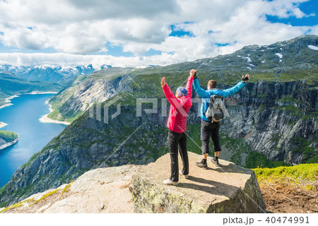Couple standing top view on the way to Trolltunga, Norway Concept of freedom and success 40474991