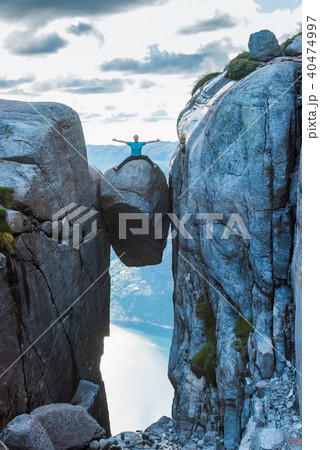 Woman on Kjeragbolten Travel in Norway Woman on Kjeragbolten Travel in Norway 40474997