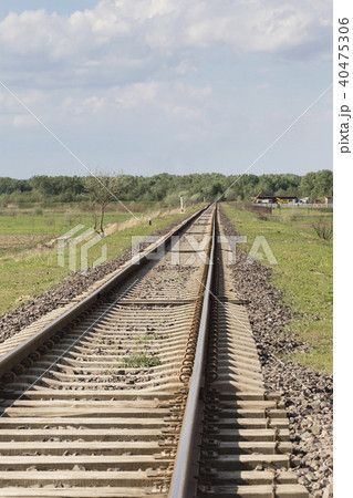 Railway track goes into the distance and up. 40475306