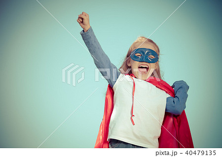 Funny little girl playing power super hero. 40479135