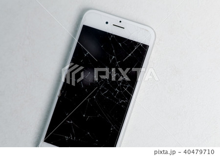 Broken mobile phone screen, scattered shards.  40479710