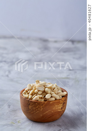 Pile of peelled peanuts isolated on white textured background, background, top view, close-up 40481627