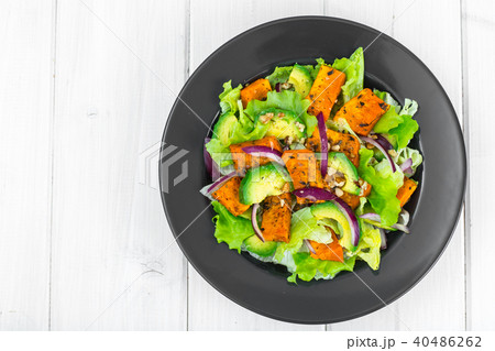 Delicious salad with avocado, pumpkin, greens Delicious salad with avocado, pumpkin, greens 40486262