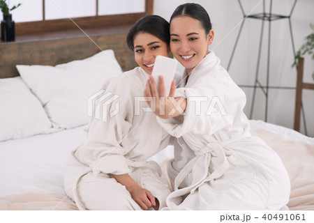 Positive attractive women taking a selfie 40491061