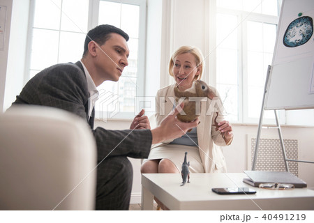 Appealing male patient using models 40491219