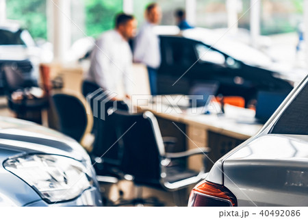 New cars at dealer showroom blurred background New cars at dealer showroom blurred background 40492086