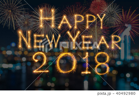 Happy new year 2018 written with Sparkle firework on fireworks with dark background, celebration and greeting cards concept 40492980