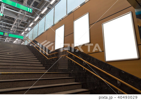 Blank billboard located in underground hall or subway for advertising, mockup concept, Low light speed shutter 40493029