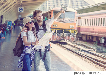 Multiethnic Travellers are looking at the map at the train station, Travel and transportation concept Multiethnic Travellers are looking at the map at the train station, Travel and transportation concept 40493420