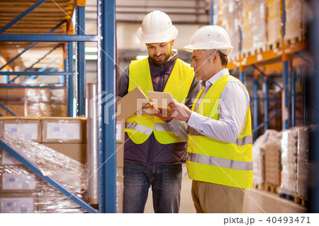 Delighted nice man holding a box 40493471