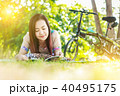 Asian woman  reading a book in the park. 40495175