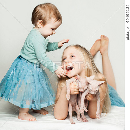 little girls playing with babies