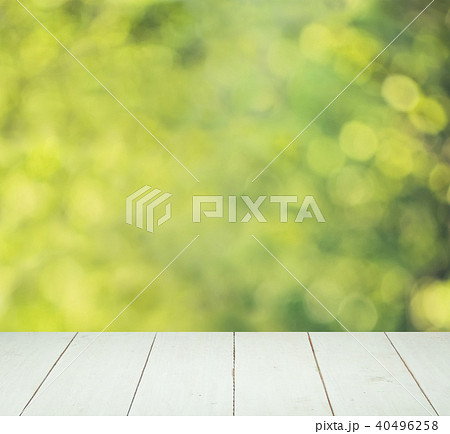 Abstract Green Bokeh and White Wooden Board Abstract Green Bokeh and White Wooden Board 40496258