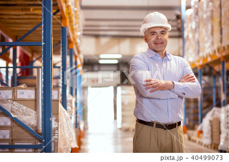 Cheerful positive businessman smiling Cheerful positive businessman smiling 40499073