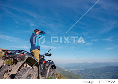 Man on the ATV Quad Bike on the mountains road. 40499422
