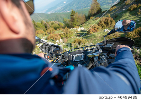 Young man on quad bike on a countryside trail. View from a quad bike. 40499489
