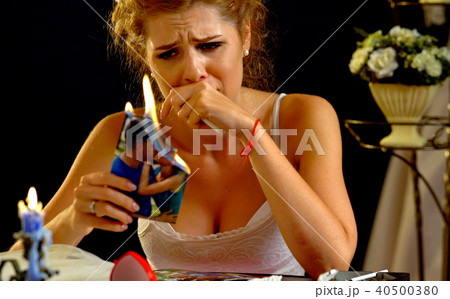 Broken heart woman. Couple break up. Burning family photo. 40500380
