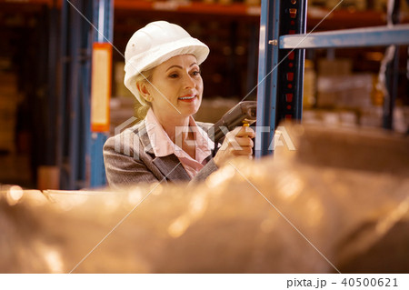Joyful delighted woman scanning goods Joyful delighted woman scanning goods 40500621