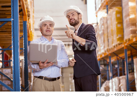 Positive delighted man talking to his manager 40500967