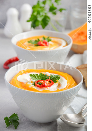 Pumpkin soup with cream and parsley. Pumpkin soup with cream and parsley. 40501303