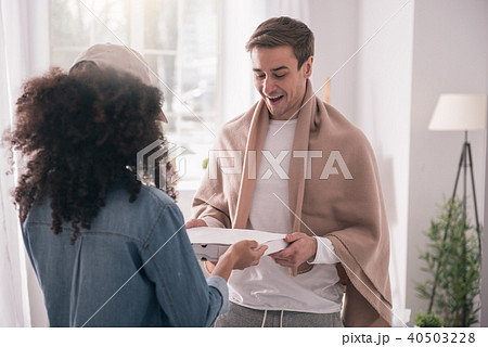 Happy nice man receiving his pizza Happy nice man receiving his pizza 40503228