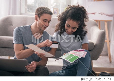 Positive joyful woman choosing colors Positive joyful woman choosing colors 40503263