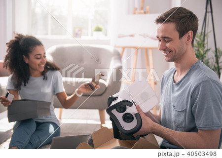Joyful pleasant man holding 3d glasses Joyful pleasant man holding 3d glasses 40503498