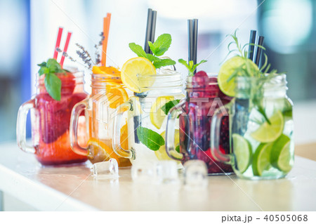 Various lemonades in mason jars and fresh fruit. Various lemonades in mason jars and fresh fruit. 40505068