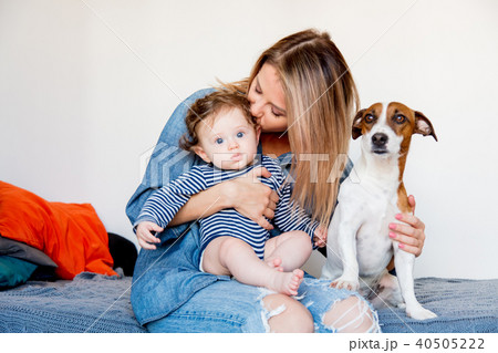 Young mother with little baby and a dog 40505222