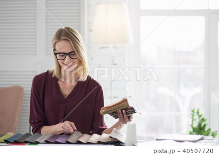 Merry female designer opting for upholstery 40507720