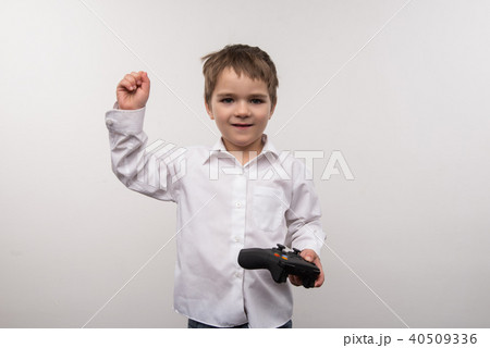 Nice cute boy playing electronic games Nice cute boy playing electronic games 40509336