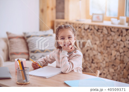 Joyful positive girl drawing a picture Joyful positive girl drawing a picture 40509371