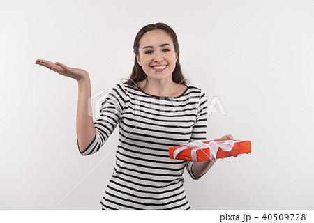 Attractive happy woman preparing a present 40509728