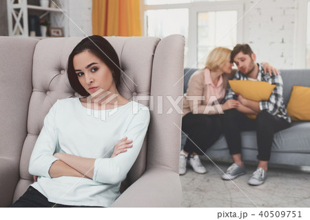 Cheerless young woman sitting in the chair Cheerless young woman sitting in the chair 40509751
