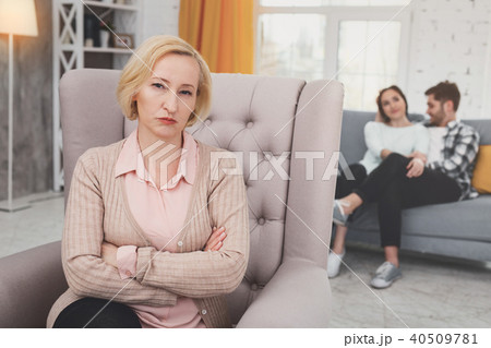 Unhappy gloomy woman sitting cross handed 40509781