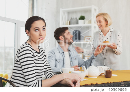 Cheerless young woman rolling her eyes Cheerless young woman rolling her eyes 40509896