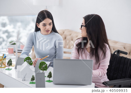 Smart female colleagues proposing innovations 40509935