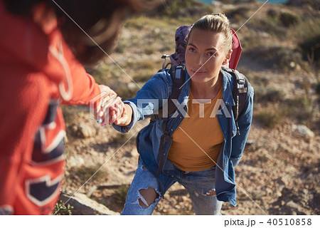 Young camper climbing the mounting Young camper climbing the mounting 40510858