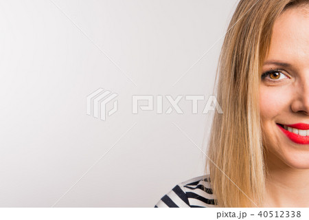 Young beautiful woman in studio. Copy space. 40512338