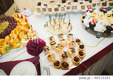 Different kinds of baked sweets on a buffet Different kinds of baked sweets on a buffet 40513163