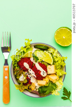 Vegan buddha bowl with beetroot meatballs Vegan buddha bowl with beetroot meatballs 40513707
